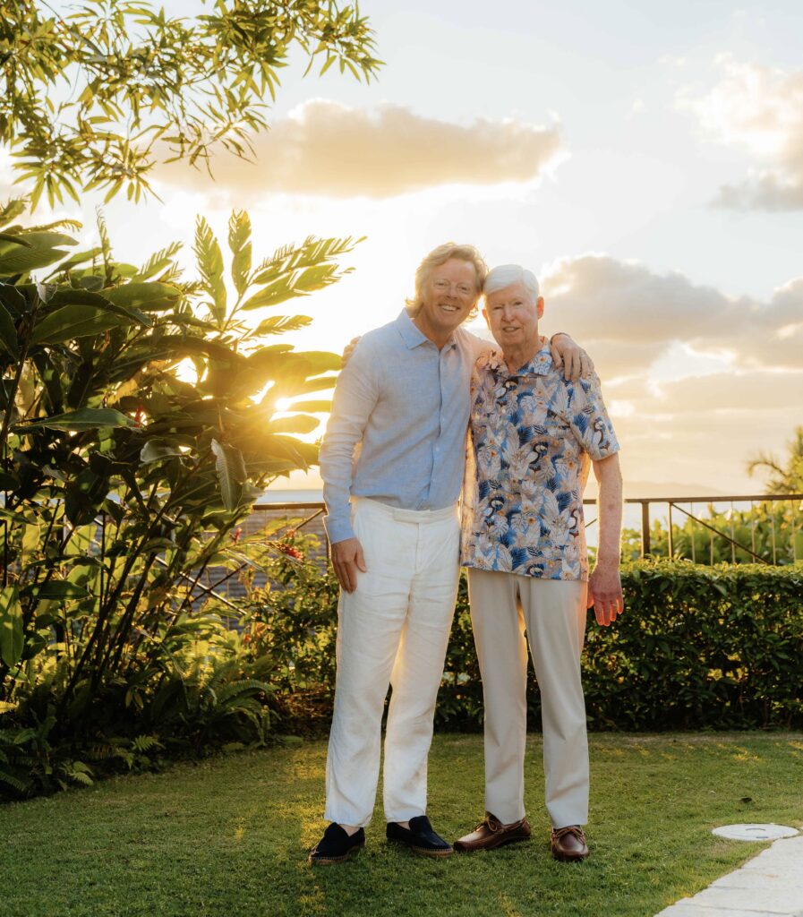 matt and rick standing in front of sunset